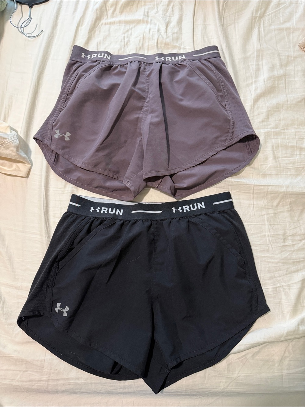 Pair of Under Armour Women’s Run Shorts — Black & Mauve